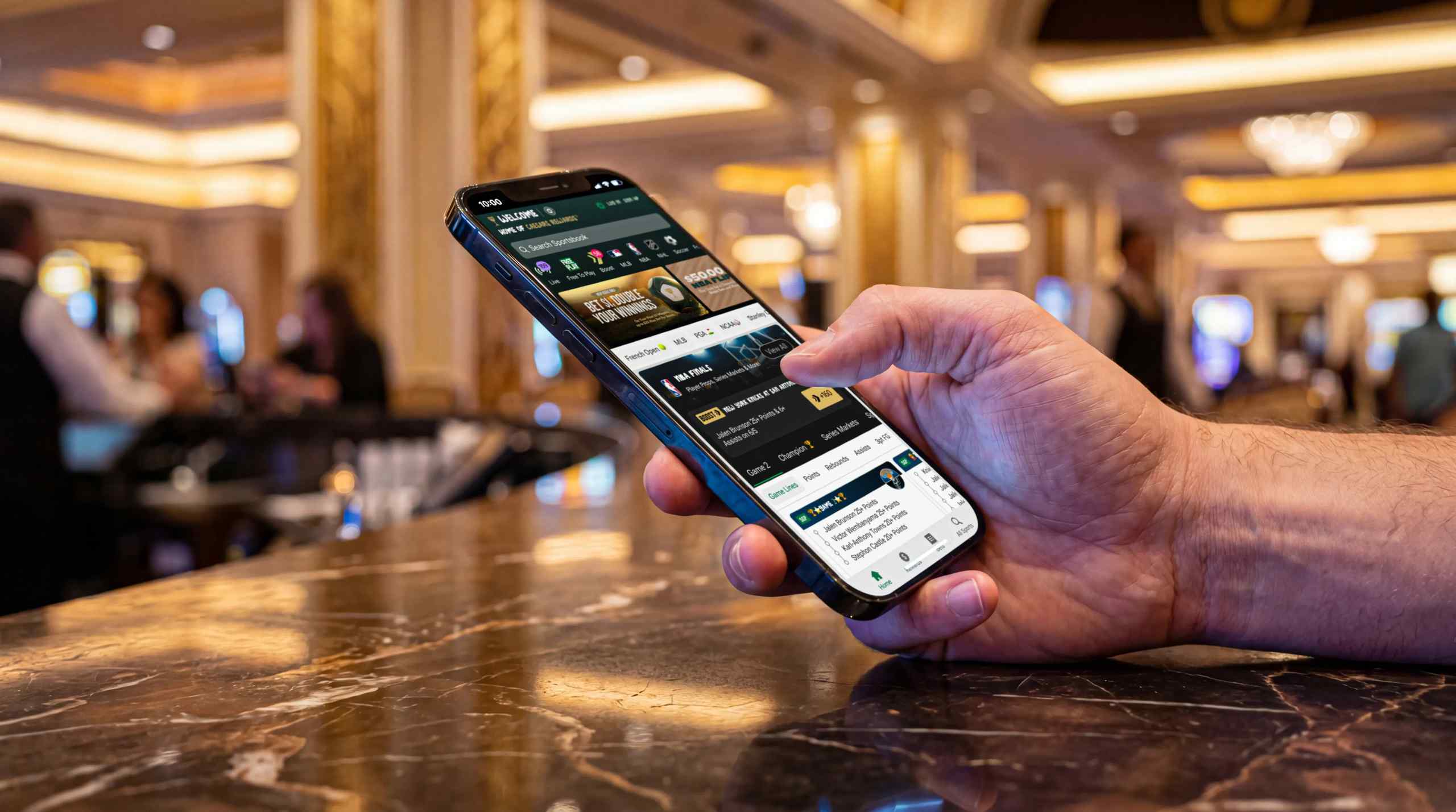 A man checking into his hotel with his smart phone